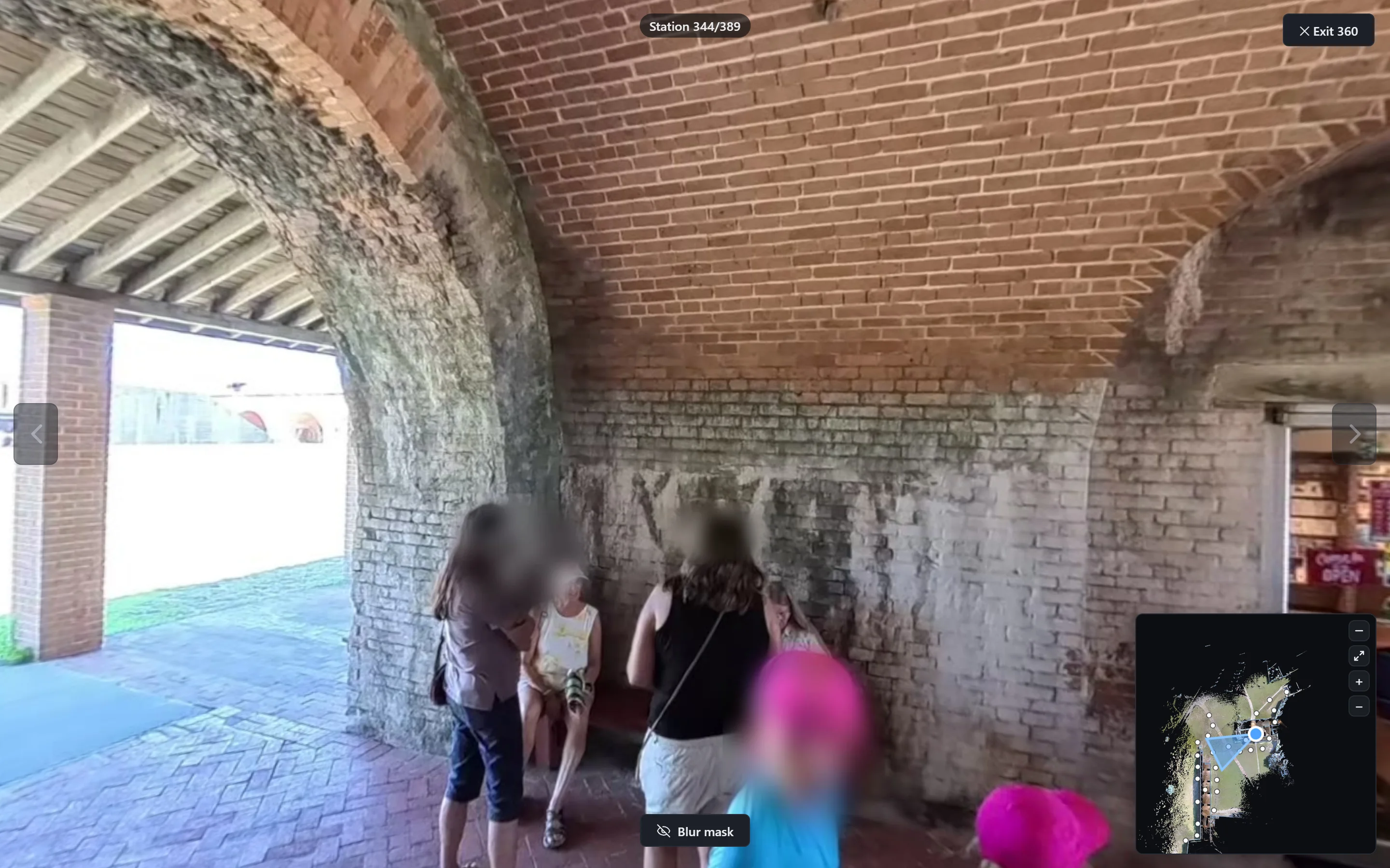 A 360 station with a group of visitors, every face automatically blurred